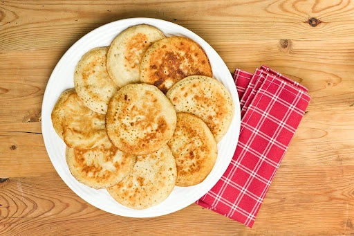 Fluffy pancakes made with protein powder, perfect for fueling your day with lasting energy. A plate of golden, delicious protein pancakes to keep you feeling full and energized.