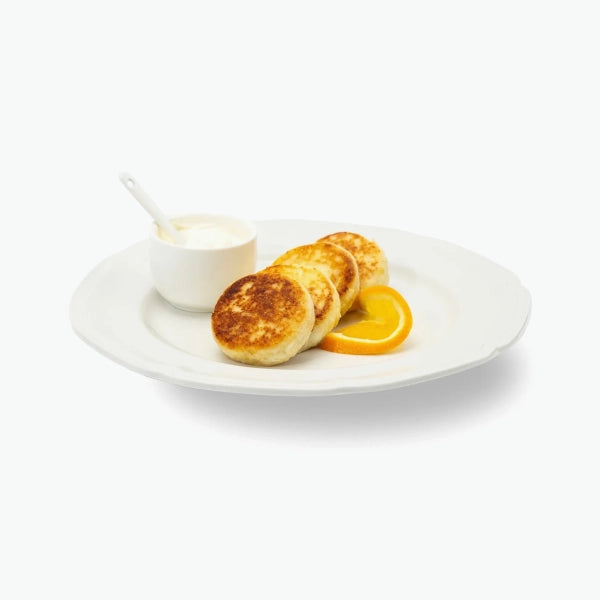 Quark fritters "Sirniki" with oranges, handmade