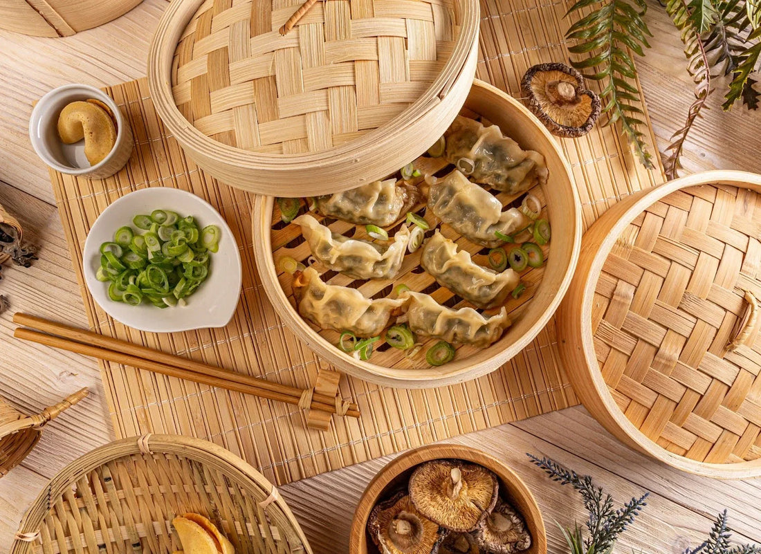 Dong Bei dumplings served in a bamboo basket, topped with fresh green onions, perfect for a traditional Dong Bei dumpling recipe.