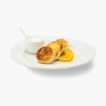 Quarkpuffer "Sirniki" mit Orangen, handgemacht