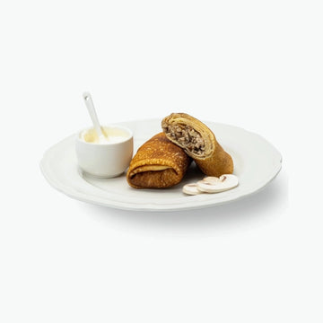 Blinis with chicken and mushrooms, handmade 