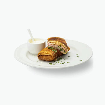 Blinis with ham and cheese filling, handmade 